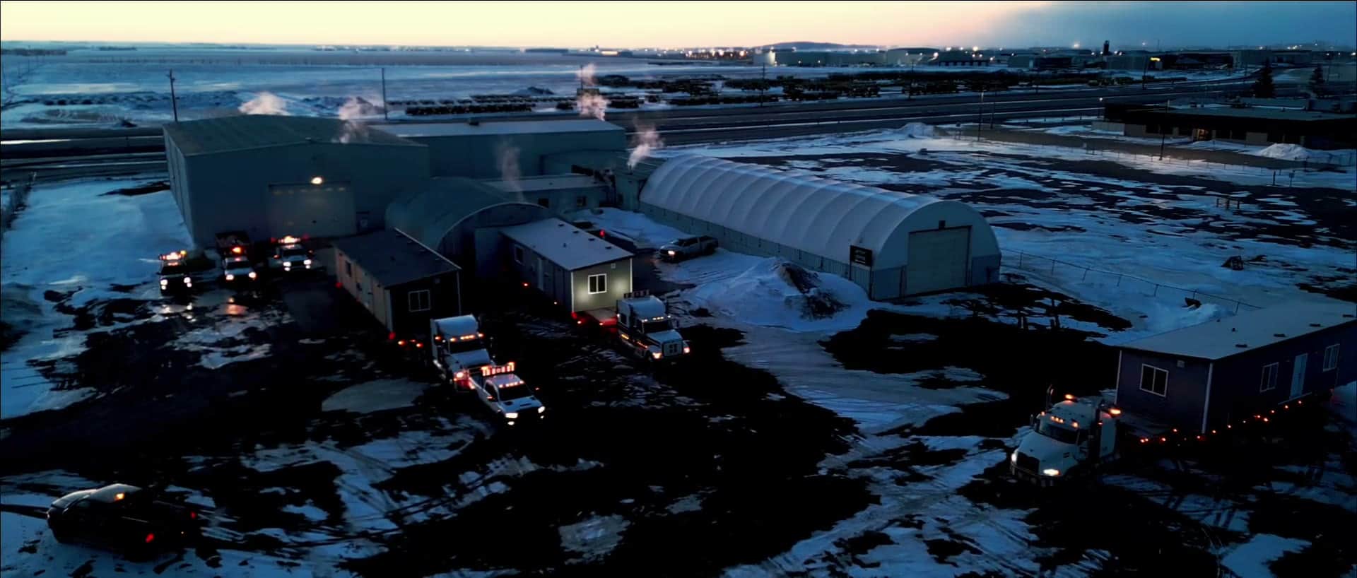 A Herauf convoy delivering modular homes on winter highways to St. Theresa Point
